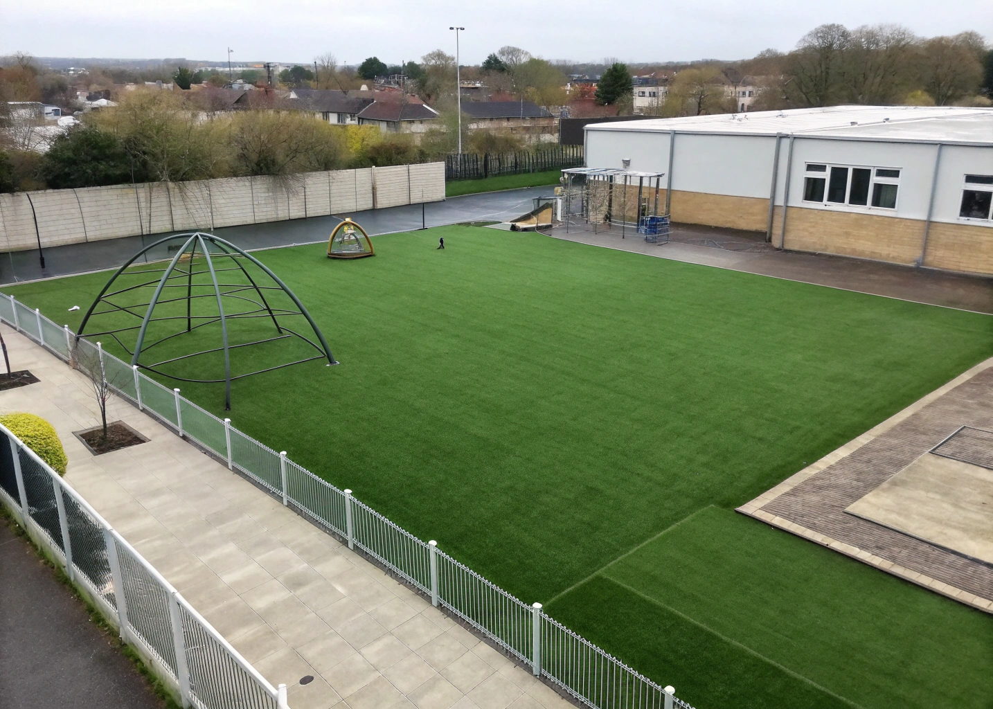 school-playground-synthetic-turf-wollongong School playground with synthetic turf installed around climbing equipment, Wollongong